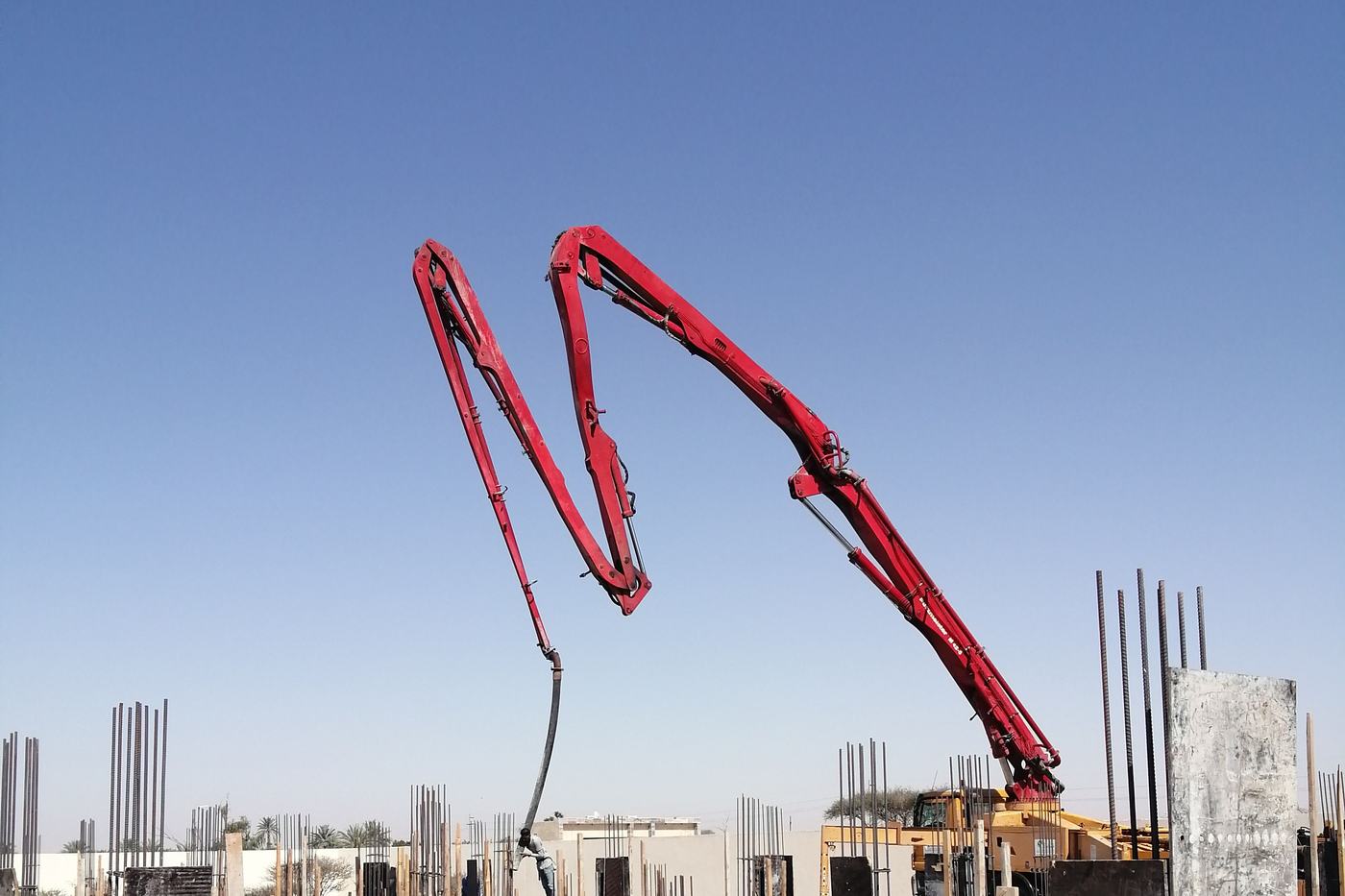 Concrete pump boom over formwork and reinforcing
