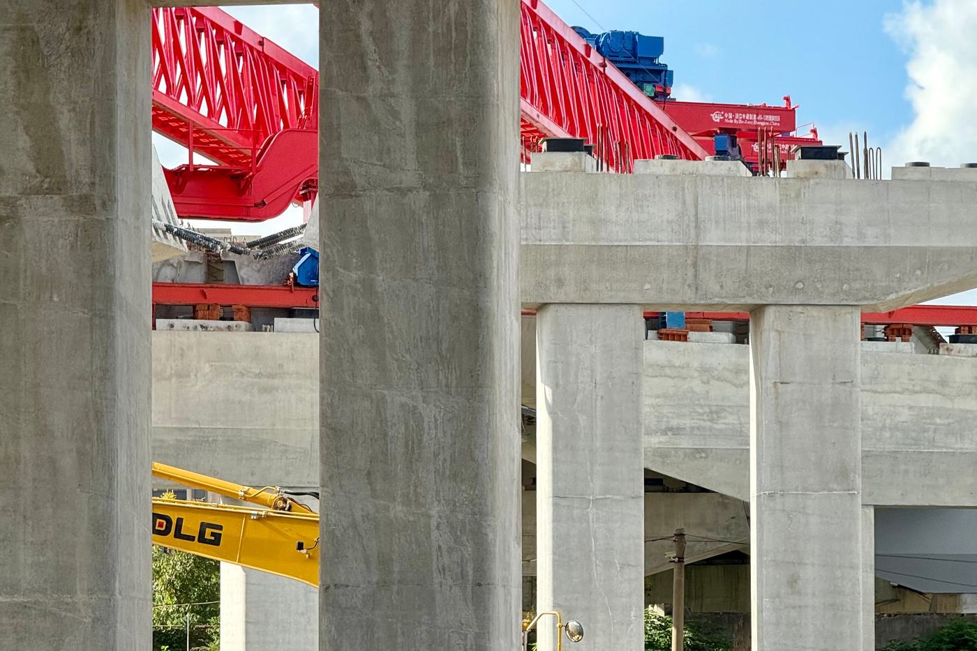 Concrete piers and girders of an elevated structure under construction